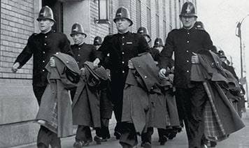 Photo of policemen in bobby hats